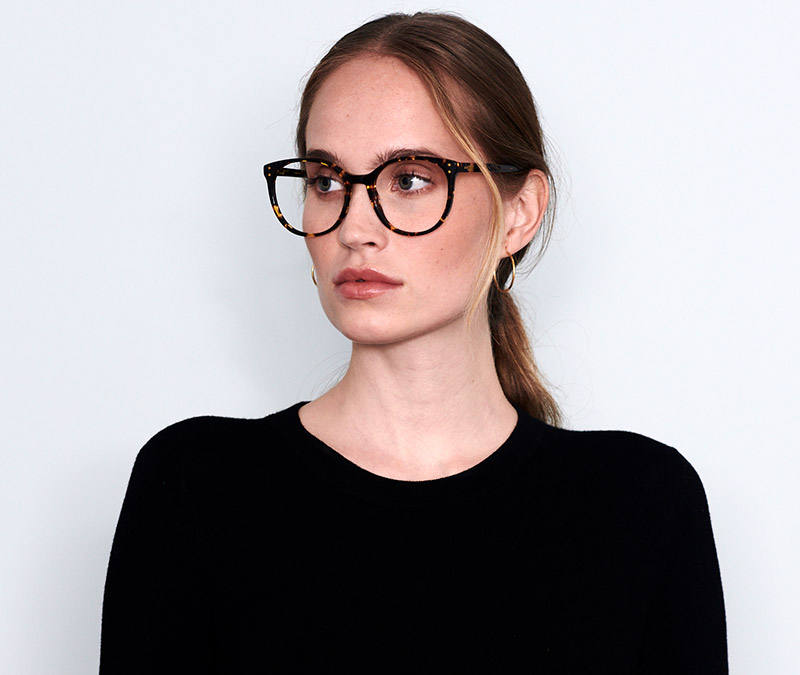 Alexis Amor Olive frames in Amber Fleck